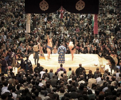 Sumo tournament in Osaka, Wrestlers and referee on the dohyo ring before the bout