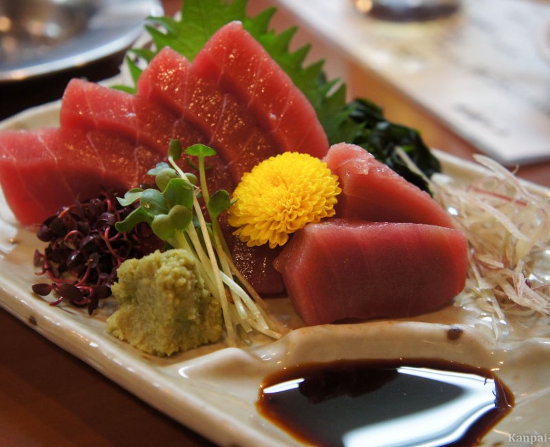Wasabi and shoyu seasoning on a tuna sashimi plate Wasabi and shoyu seasoning on a tuna sashimi plate