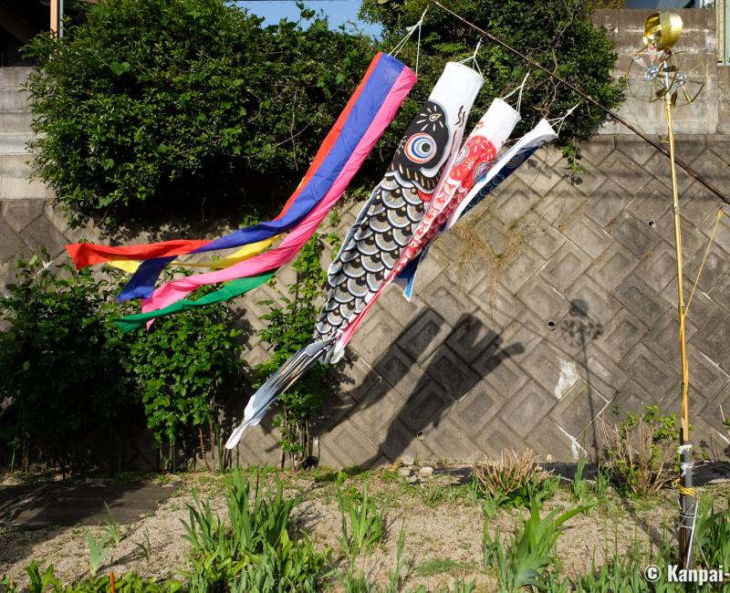 Traditional koi nobori pole in a private garden in Japan Traditional koi nobori pole in a private garden in Japan