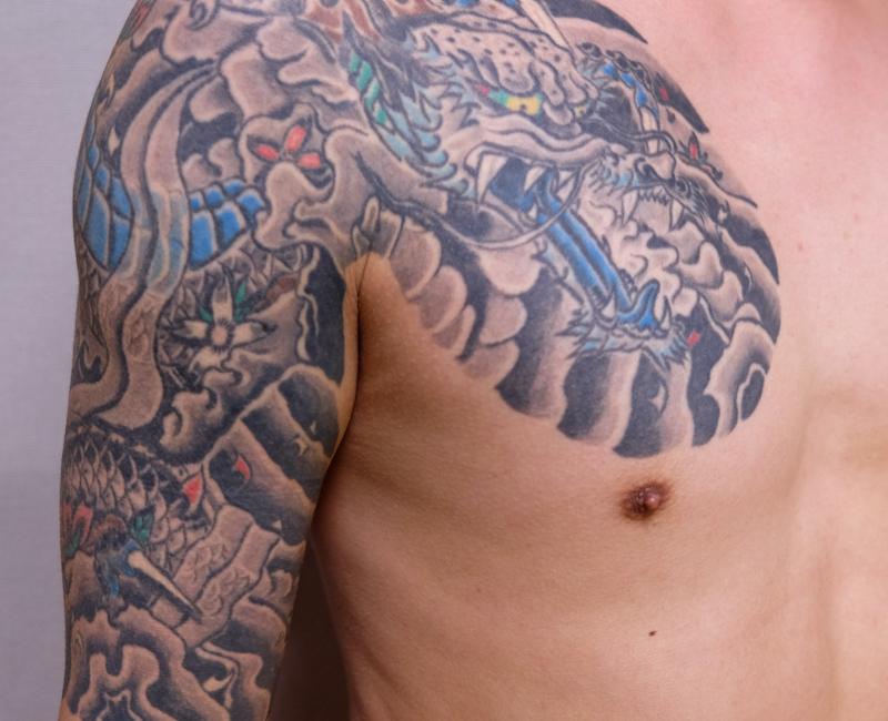Traditional Japanese tattoo on a man's shoulder and arm
