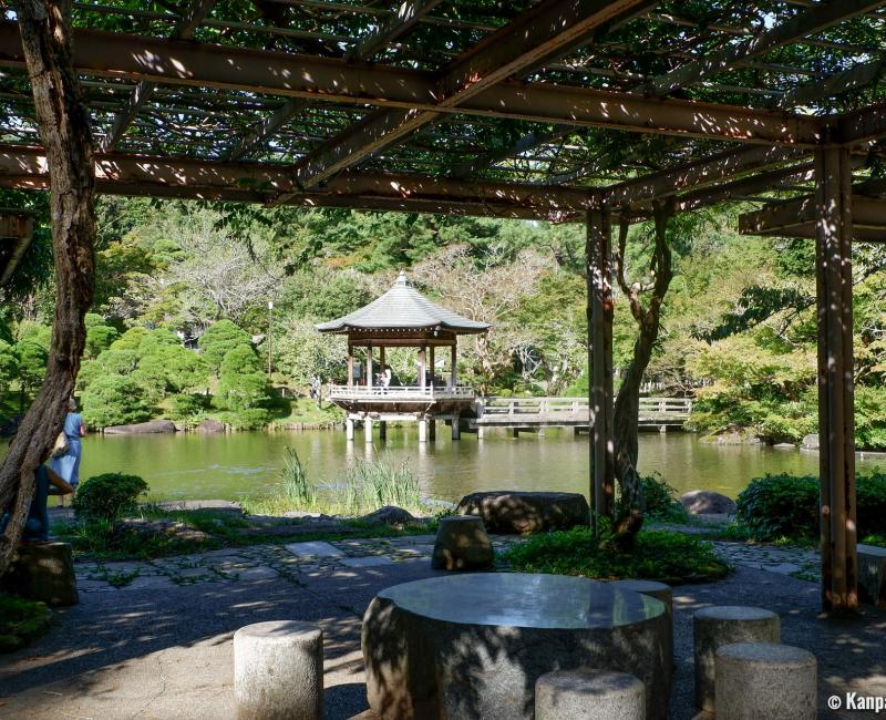 Narita-san Park, View on Ukimido Pavilion from the wisteria shelter Narita-san Park, View on Ukimido Pavilion from the wisteria shelter