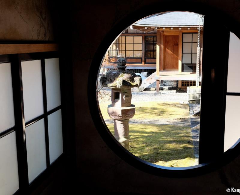 Tamozawa Imperial Villa Memorial Park in Nikko, View on the garden from a round window