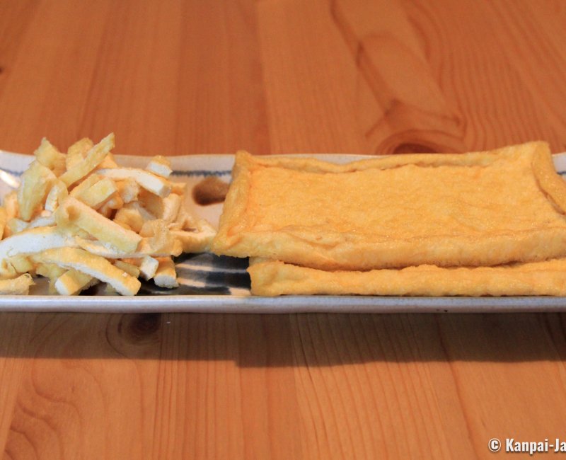 Aburaage fried tofu in slices and pieces in a plate