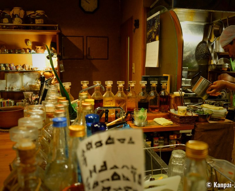 Mori no Kenja (Ishigaki), Spirits and eaux-de-vies displayed at the bar counter Mori no Kenja (Ishigaki), Spirits and eaux-de-vies displayed at the bar counter