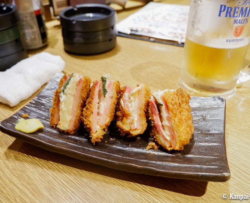 Slices of breaded meat to share at a Tokyo izakaya pub