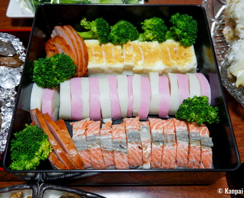 Osechi Ryori, Traditional dishes, including Kamaboko fish cake, in a bento box