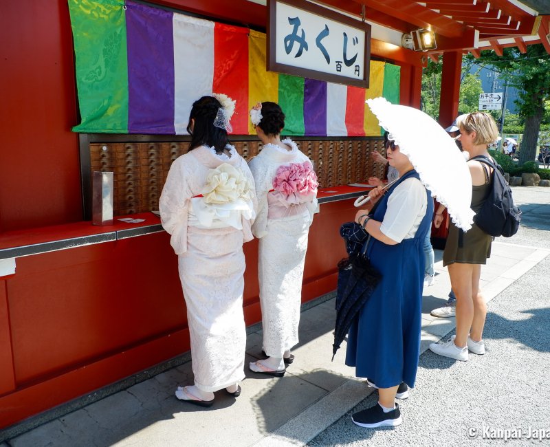 Summer Heat in Japan, Visitors wearing yukata and using an umbrella in Asakusa, Tokyo Summer Heat in Japan, Visitors wearing yukata and using an umbrella in Asakusa, Tokyo