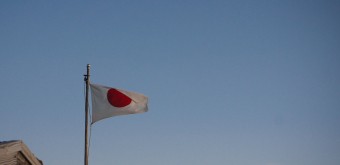 The Japanese flag at the top of Mount Fuji