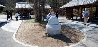 Ghibli Park (Nagoya), Sekijin stone statue (Spirited Away) near Toromon Gate towards Dondoko Forest