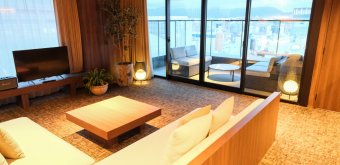 The Royal Park Canvas Fukuoka Nakasu (Kyushu), Living area and balcony in the Balcony Suite Twin/King