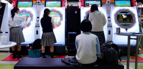 Japanese girls playing at an arcade game (Game Center) in Tokyo