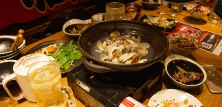 Japanese nabe hot pot on a table at a Tokyo izakaya pub