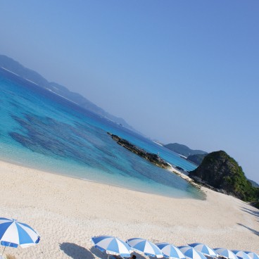 Zamami Island (Okinawa), View on the white sand beach with parasols