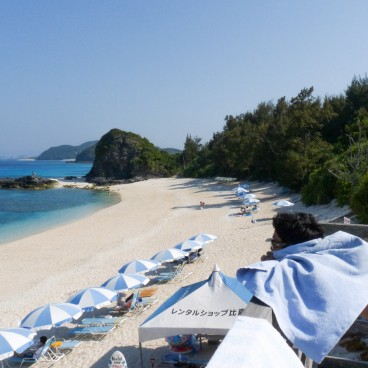 Zamami Island (Okinawa), View on the white sand beach with parasols 2