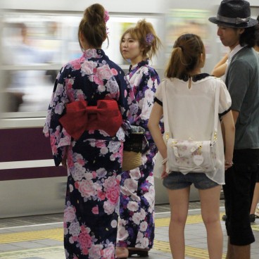 Tenjin Matsuri in Osaka, Festival goers in traditional yukata in the train 2