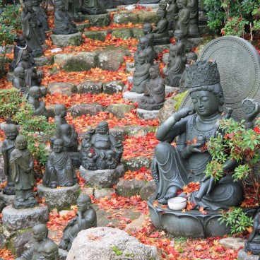 Daisho-in Temple (Miyajima), Buddhist statues laden stairway covered in red maple tree leaves in autumn 