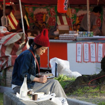 Kema Sakuranomiya Park in Osaka, Food stalls and cherry blossom party goer