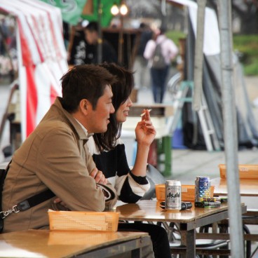 Kema Sakuranomiya Park in Osaka, Visitors enjoying a drink at a food stall