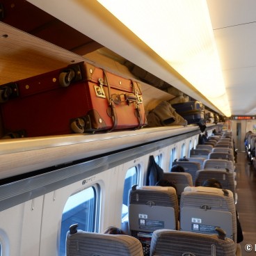 Luggage racks above seats in Hayabusa Tohoku Shinkansen