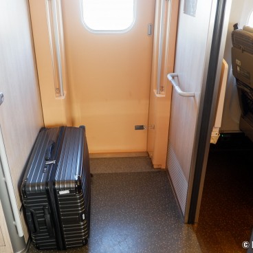 Suitcase at the entrance of the carriage in Hayabusa Tohoku Shinkansen
