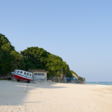 Okinawa, A boat and rock formations on Mibaru Beach