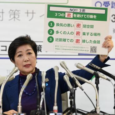 The word of the year 2020: San mitsu (or 3C), sign held by Yuriko Koike (the Governor of Tokyo)