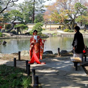 Japanese couple wearing kimono for their wedding pictures in Shin-Edogawa Garden in Tokyo