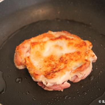 Chicken cooked in a pan with teriyaki sauce