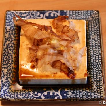 Hiyayakko cold tofu dish topped with katsuobushi flakes
