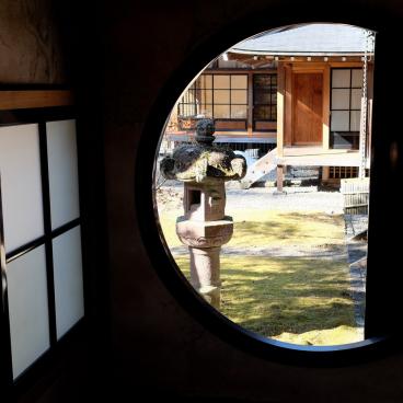Tamozawa Imperial Villa Memorial Park in Nikko, View on the garden from a round window