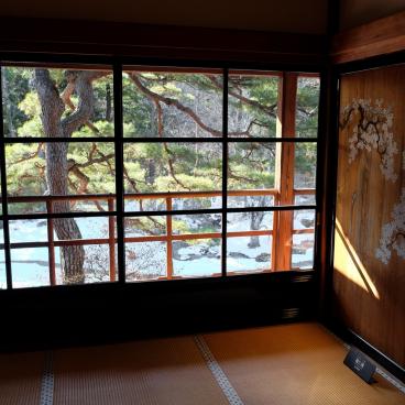 Tamozawa Imperial Villa Memorial Park in Nikko, View on the garden in winter from a traditional room