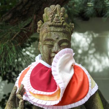 Chion-in temple in Kyoto, Buddhist statue decorated with layers of bibs