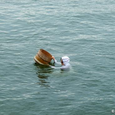 Mie prefecture, Ama performance in a traditional diving suit at Mikimoto Pearl Island in Toba