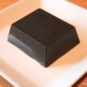Sesame black tofu (goma-tofu) in a plate