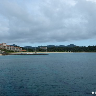 Cape Busena (Nago, Okinawa Honto), View on the coastline and the Busena Terrace Hotel from the underwater observatory's pier