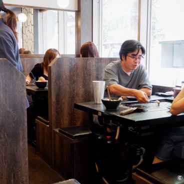 Tsukishima (Tokyo), In a monjayaki restaurant