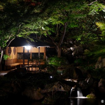 Autumn Illuminations in Rikugi-en (Tokyo), View on Takimi-chaya pavilion and Mizuwake-ishi stone and waterfall