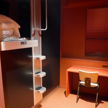 Capsule Inn Osaka (Umeda), View of the entrance of a New Deluxe capsule and the desk area at the hotel