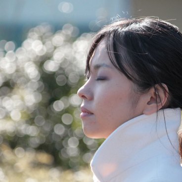 Kamakura, Japanese woman enjoying the sun at Hase-dera temple