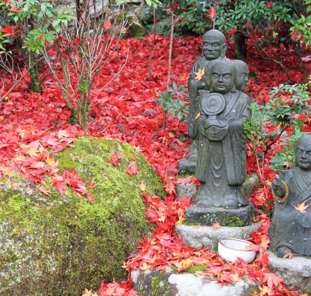 Daisho-in Temple (Miyajima), Buddhist statues laden stairway covered in red maple tree leaves in autumn 