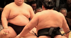 Sumo tournament in Osaka, Wrestlers and referee on the dohyo ring before the bout