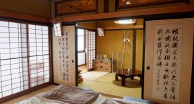 Entrance of Enishi residence in Kakunodate with two Akita-dogs